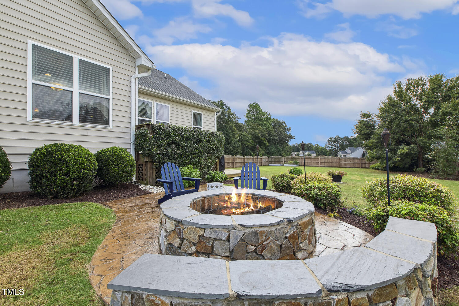 3604 Norman Blalock Road Willow Spring, NC 27592 - Photo 50 of 51 a view of a backyard with a tub and outdoor seating