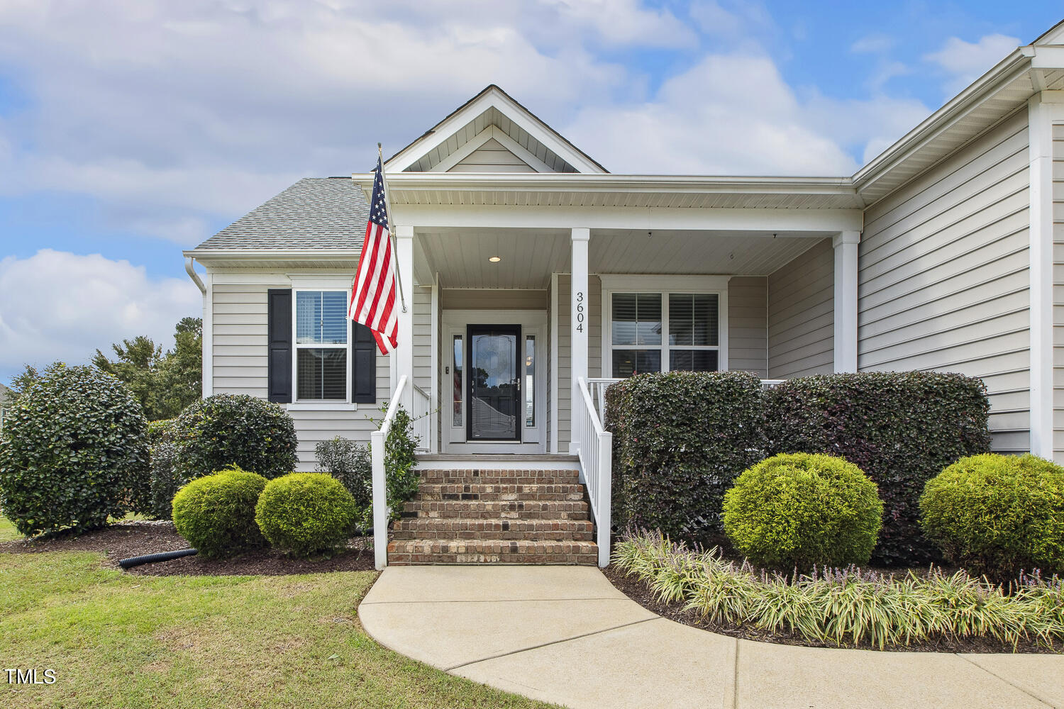 3604 Norman Blalock Road Willow Spring, NC 27592 - Photo 5 of 51 a front view of a house with garden