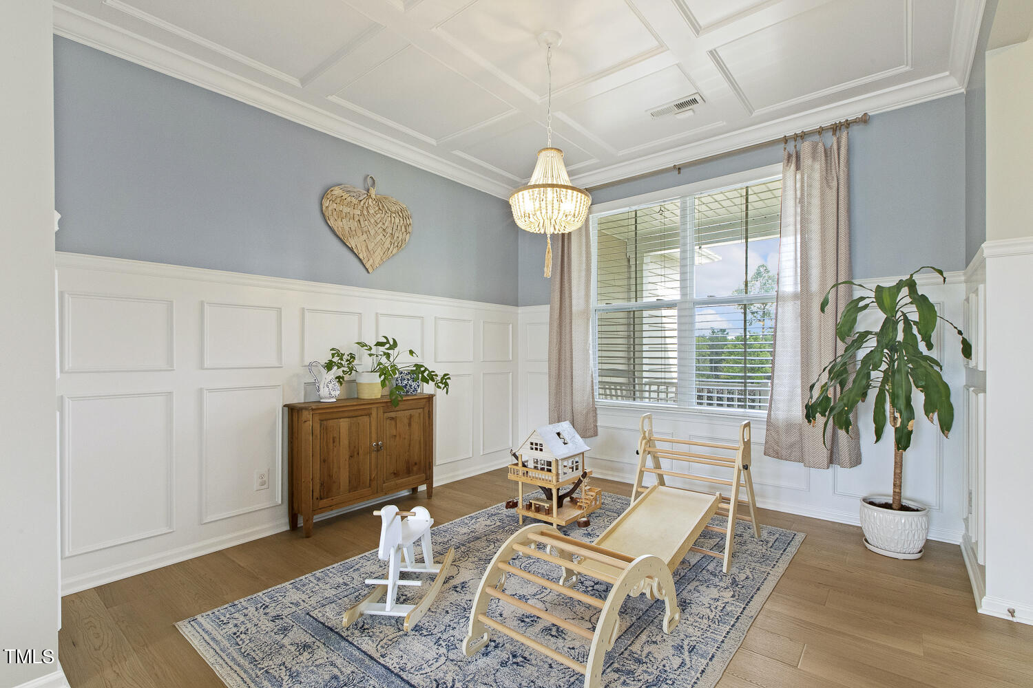 3604 Norman Blalock Road Willow Spring, NC 27592 - Photo 10 of 51 a living room with furniture and a potted plant