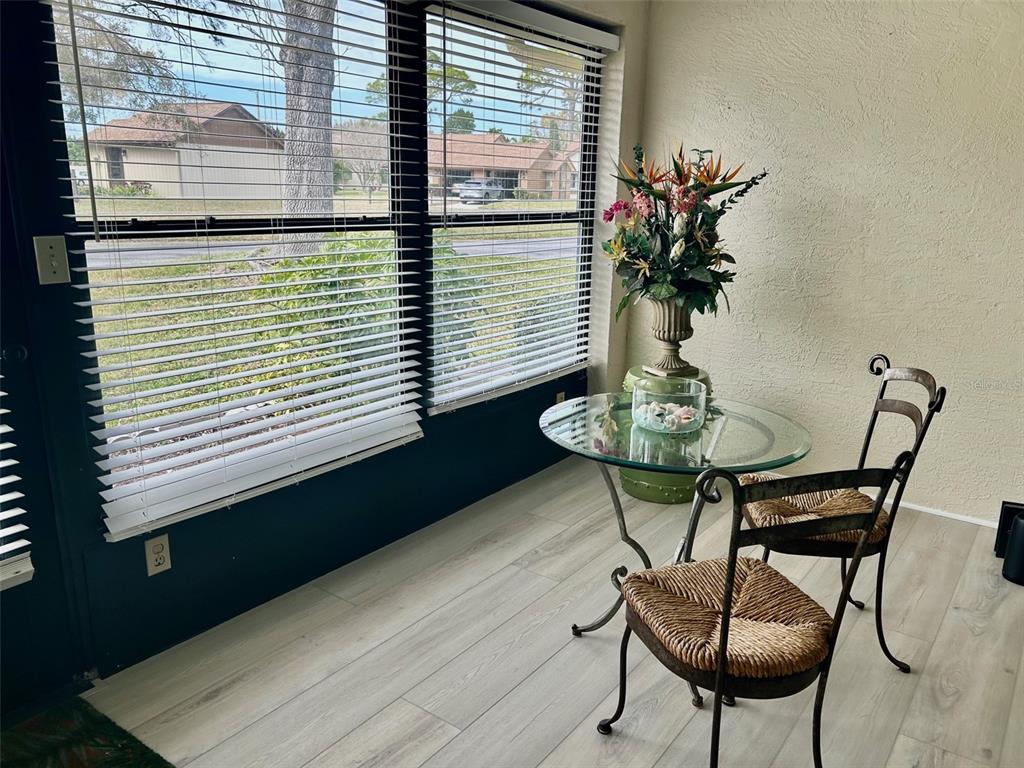 2567 Oakleaf Lane, Unit 41B Clearwater, FL 33763 - Photo 12 of 24 a table and chairs in a balcony