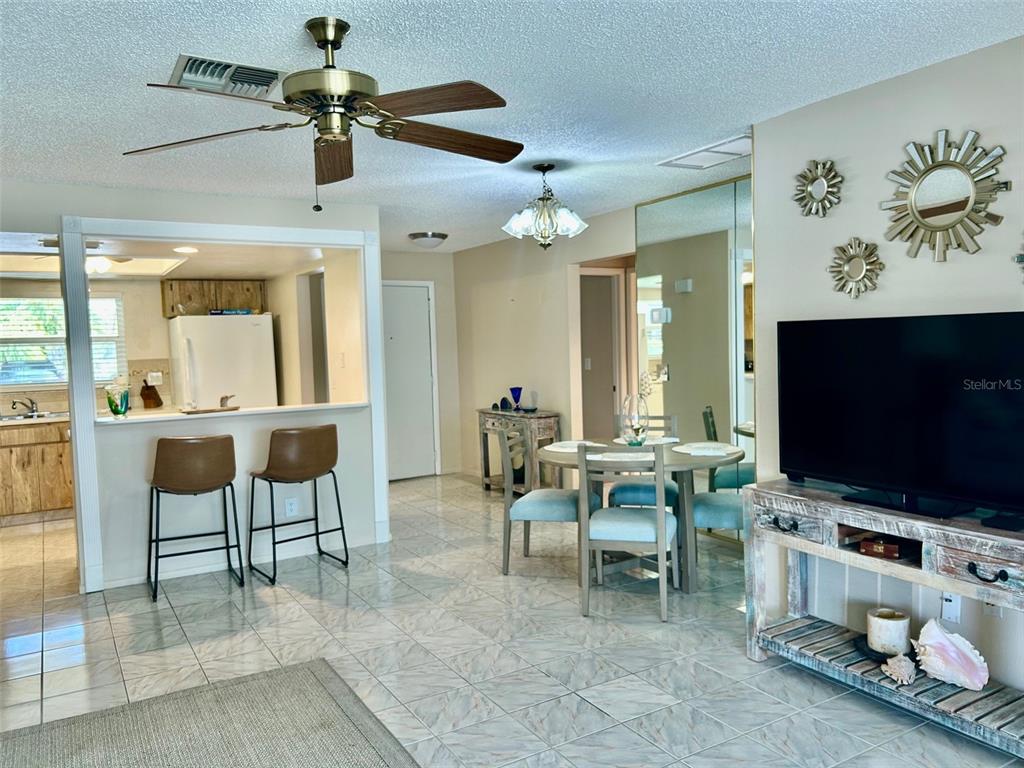 2567 Oakleaf Lane, Unit 41B Clearwater, FL 33763 - Photo 24 of 24 a view of a livingroom with furniture and a flat screen tv