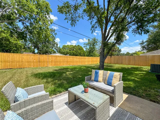 a view of a yard with furniture