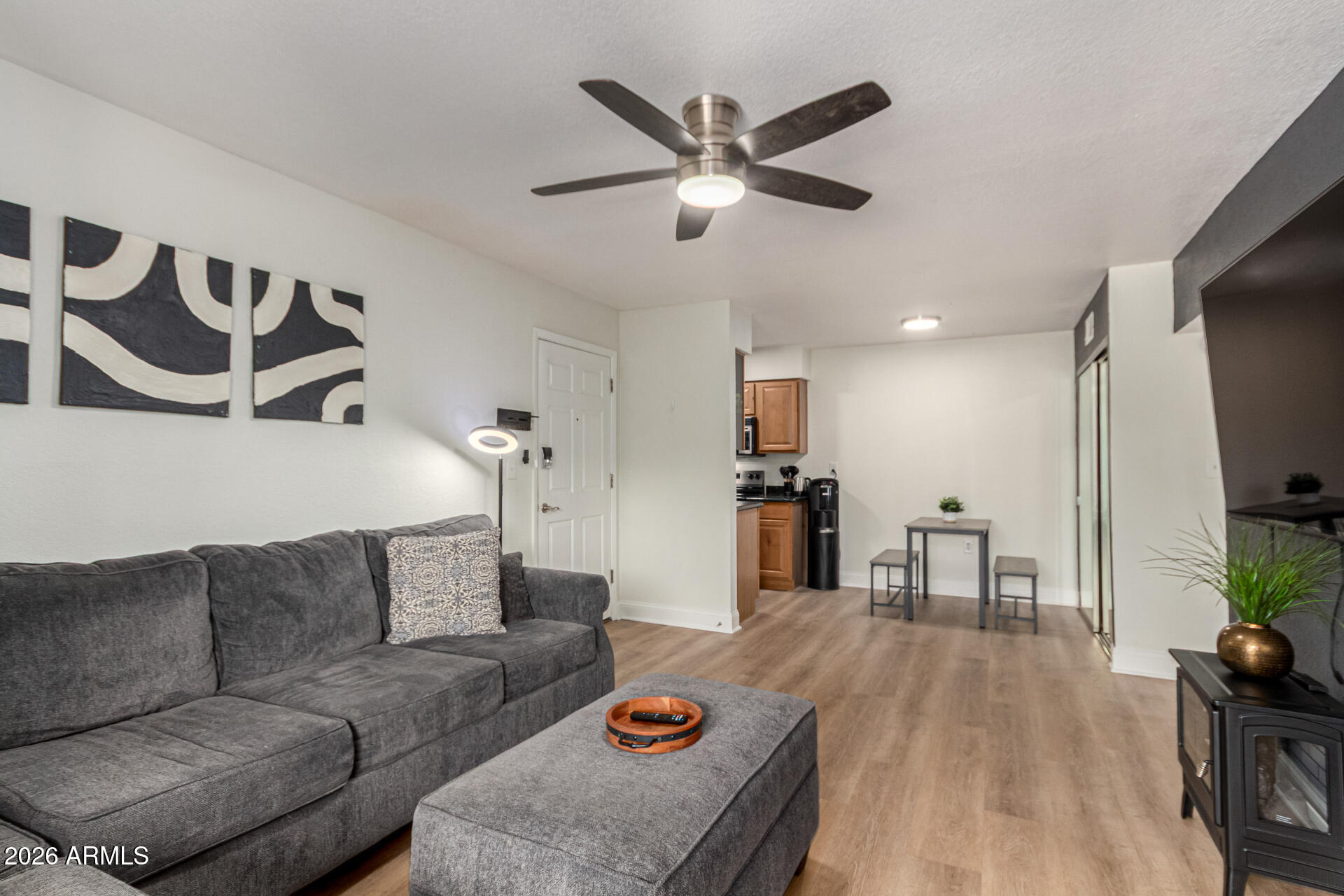 5877 North Granite Reef Road, Unit 1133 Scottsdale, AZ 85250 - Photo 6 of 33 a living room with furniture and wooden floor