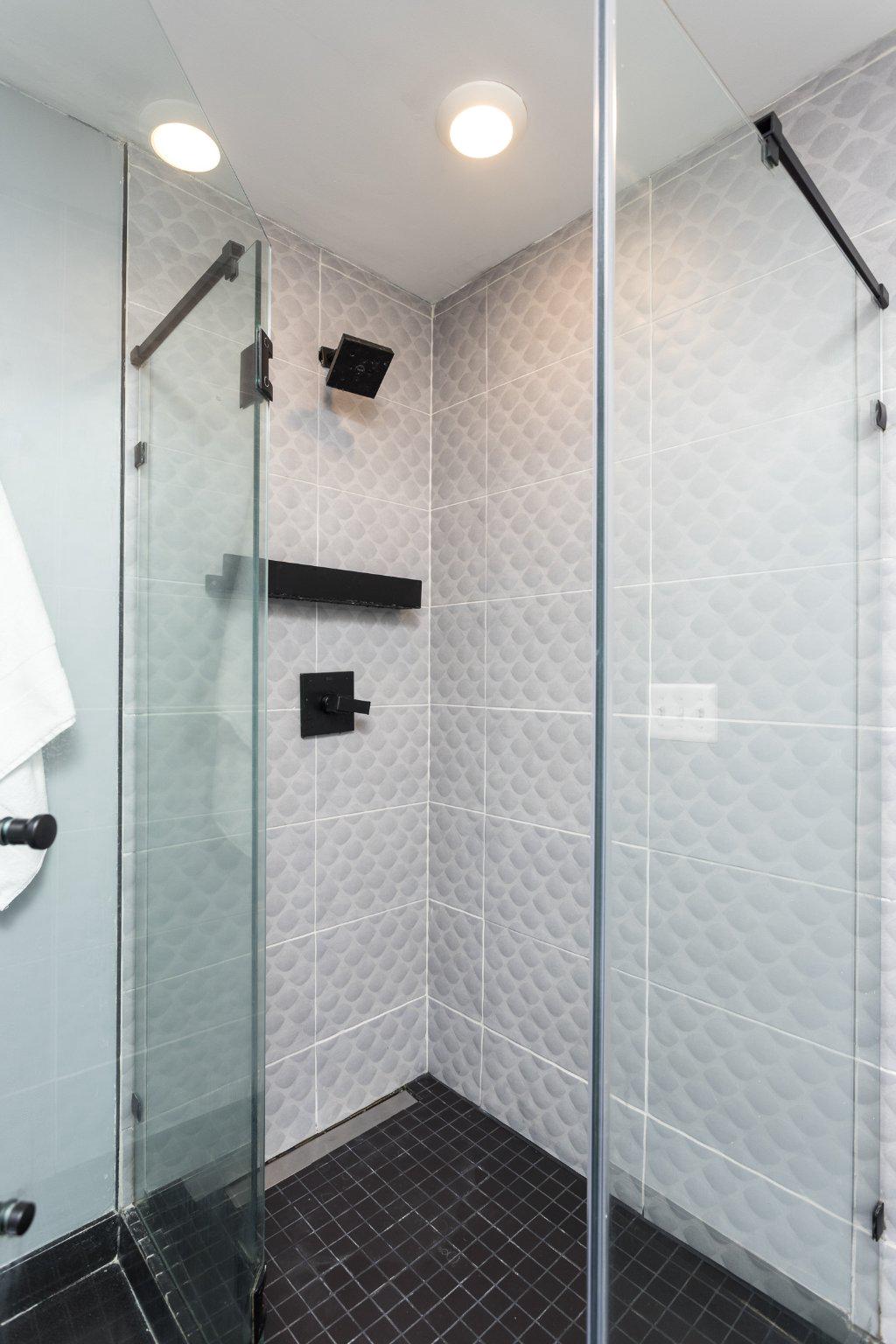 7006 Copeleigh Road Baltimore, MD 21212 - Photo 25 of 43 a bathroom with a shower and a mirror