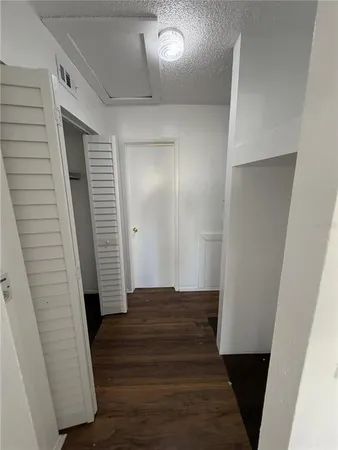 a view of front door with wooden floor