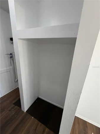 a view of balcony with wooden floor