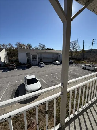 a view of a yard with a house and a tree