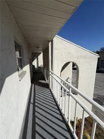 a view of a swimming pool with an outdoor space and seating area