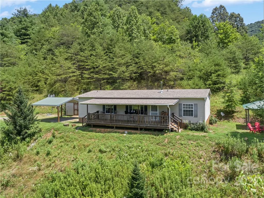 70 Sugar Cove Road Clyde, NC 28721 - Photo 1 of 21 front view of a house with a yard