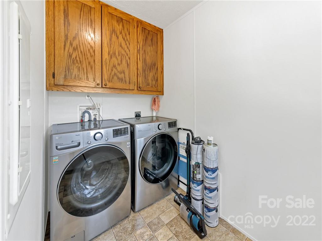 70 Sugar Cove Road Clyde, NC 28721 - Photo 15 of 21 a utility room with sink dryer and washer