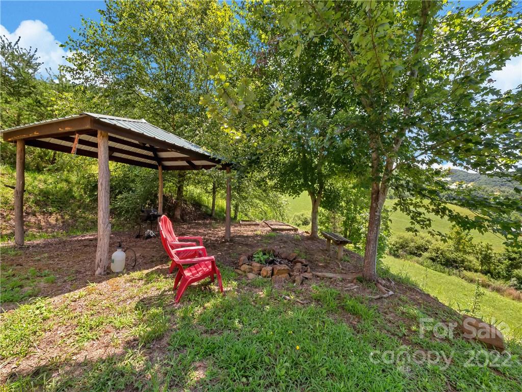 70 Sugar Cove Road Clyde, NC 28721 - Photo 19 of 21 a backyard of a house with seating space