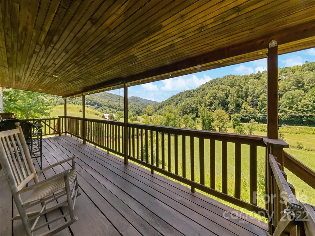 70 Sugar Cove Road Clyde, NC 28721 - Photo 2 of 21 a view of balcony with wooden floor