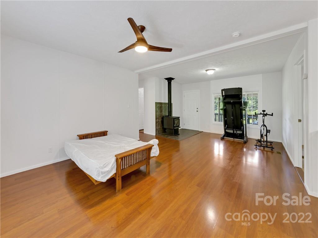 70 Sugar Cove Road Clyde, NC 28721 - Photo 4 of 21 a living room with hard wood floors and a table
