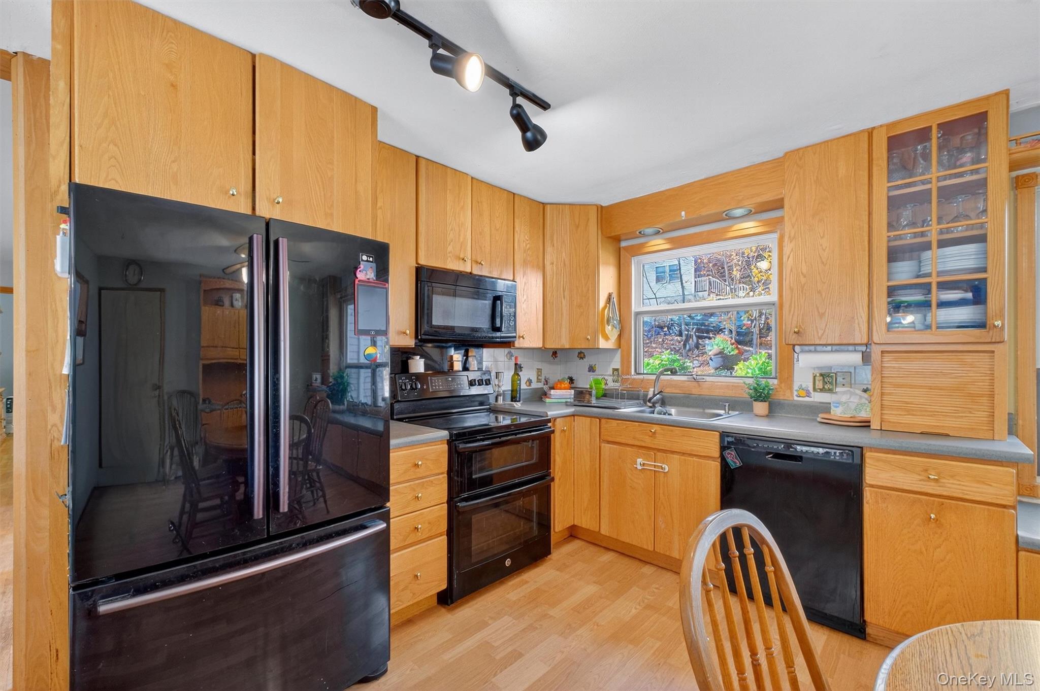 10 Byram Road Carmel, NY 10512 - Photo 11 of 49 a kitchen with granite countertop stainless steel appliances and wooden cabinets