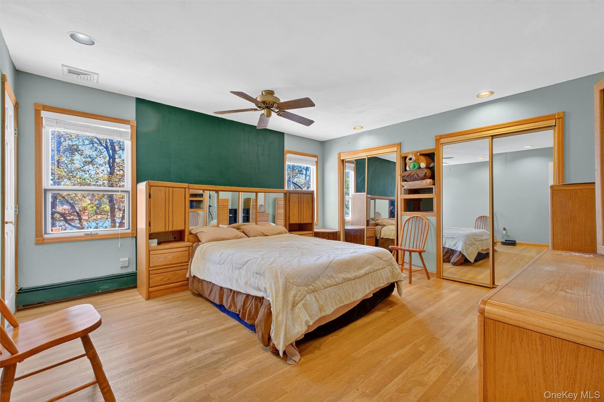 10 Byram Road Carmel, NY 10512 - Photo 14 of 49 a bedroom with a large bed and a chandelier