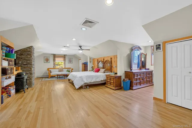 a bedroom with a bed and a walk in closet