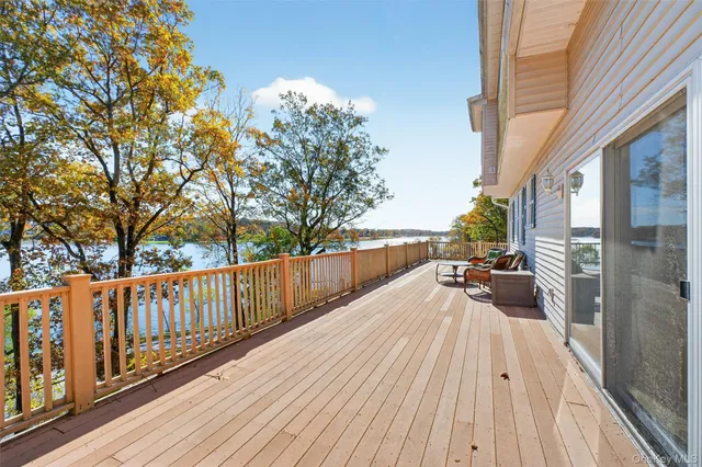 a view of balcony with wooden floor