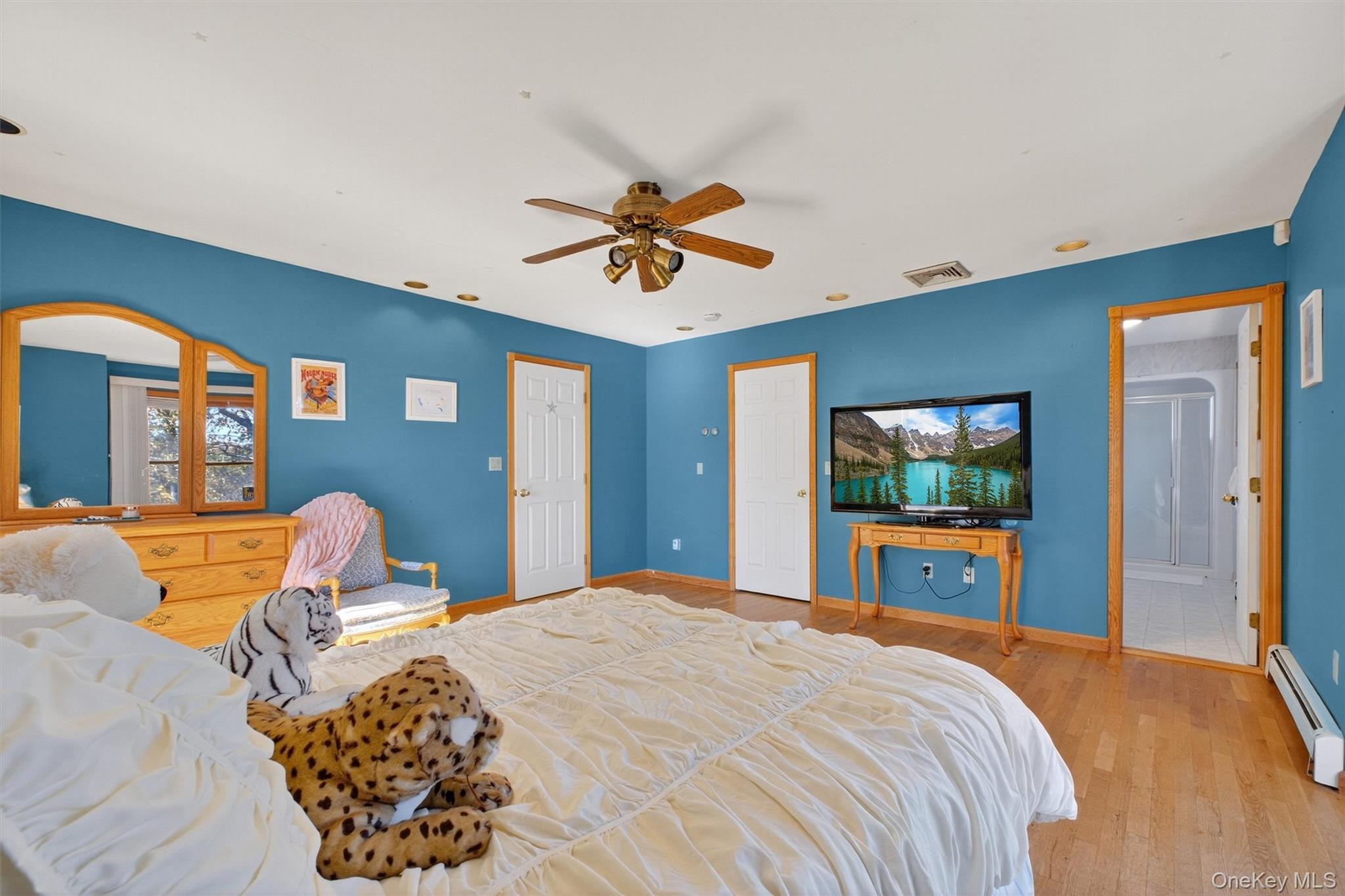 10 Byram Road Carmel, NY 10512 - Photo 22 of 49 a bedroom with a bed and a chandelier