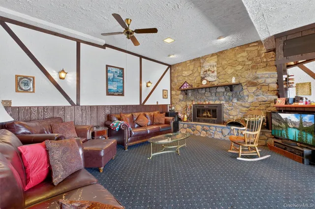 a living room with a couch and a fireplace