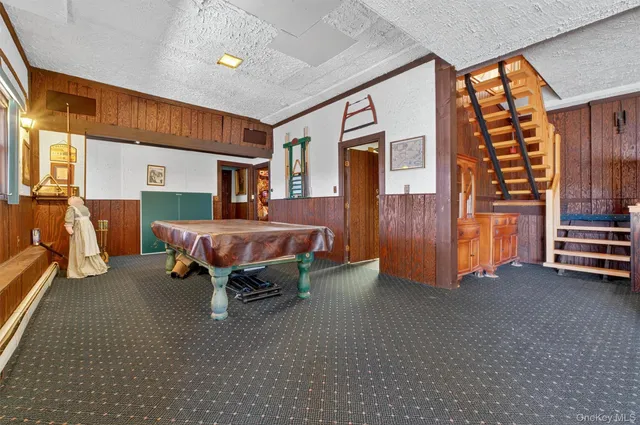 a dining room with furniture and a window