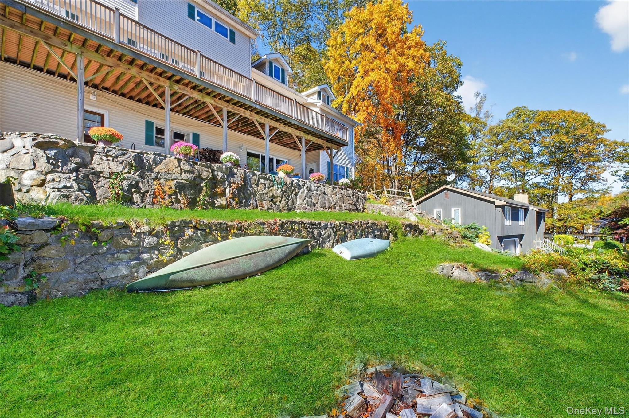 10 Byram Road Carmel, NY 10512 - Photo 35 of 49 a view of a house with a big yard potted plants and large tree