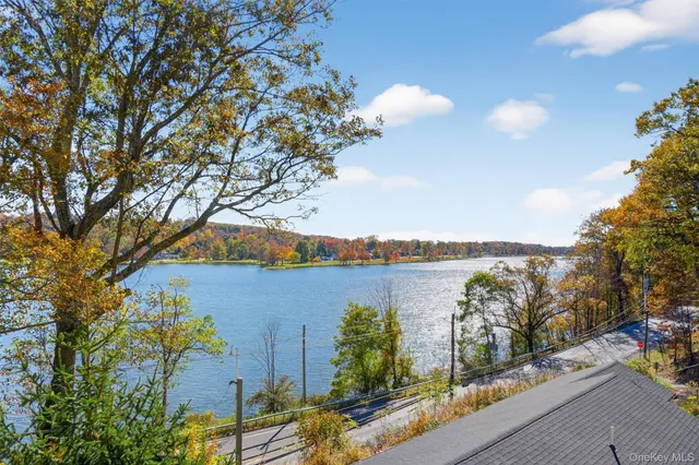 an aerial view of a house with a lake view