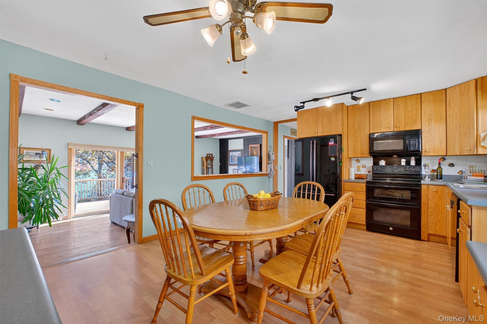 10 Byram Road Carmel, NY 10512 - Photo 9 of 49 a dining room with furniture a chandelier and wooden floor