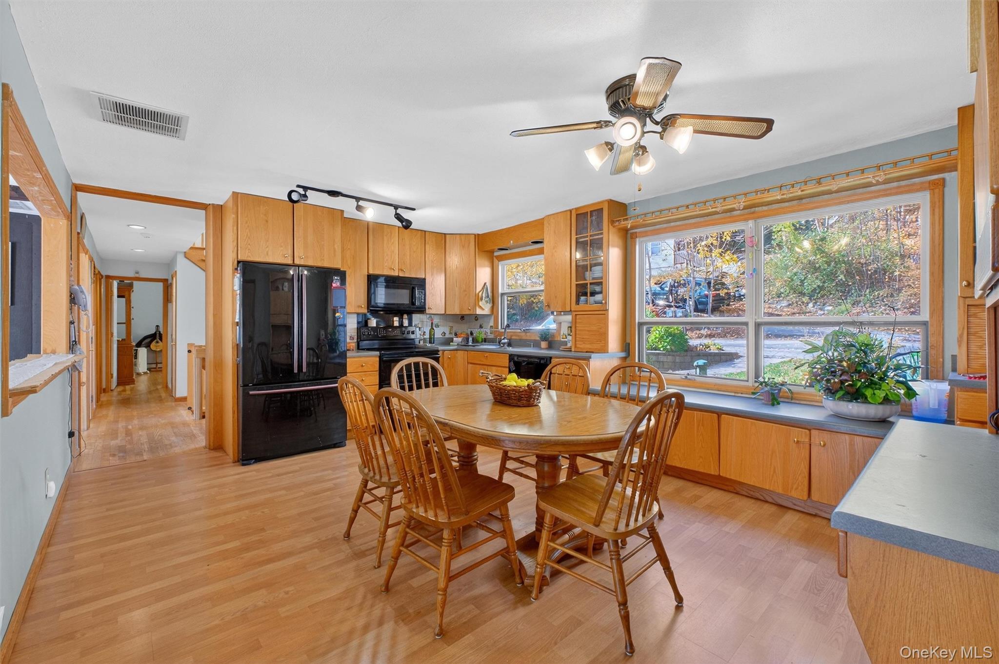 10 Byram Road Carmel, NY 10512 - Photo 10 of 49 a dining room with furniture a chandelier and wooden floor