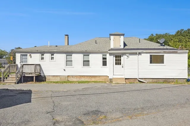 a front view of a house with a empty space