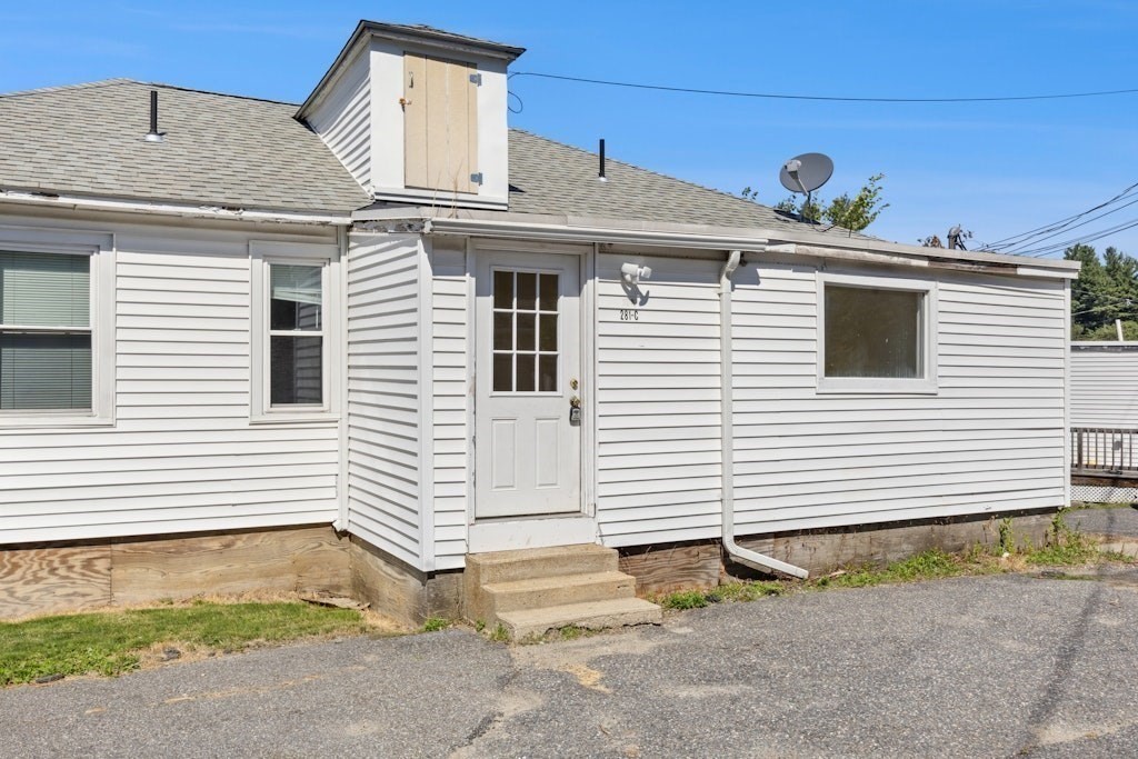 281 C King, Unit C Northborough, MA 01532 - Photo 2 of 19 a view of a house with a yard and garage