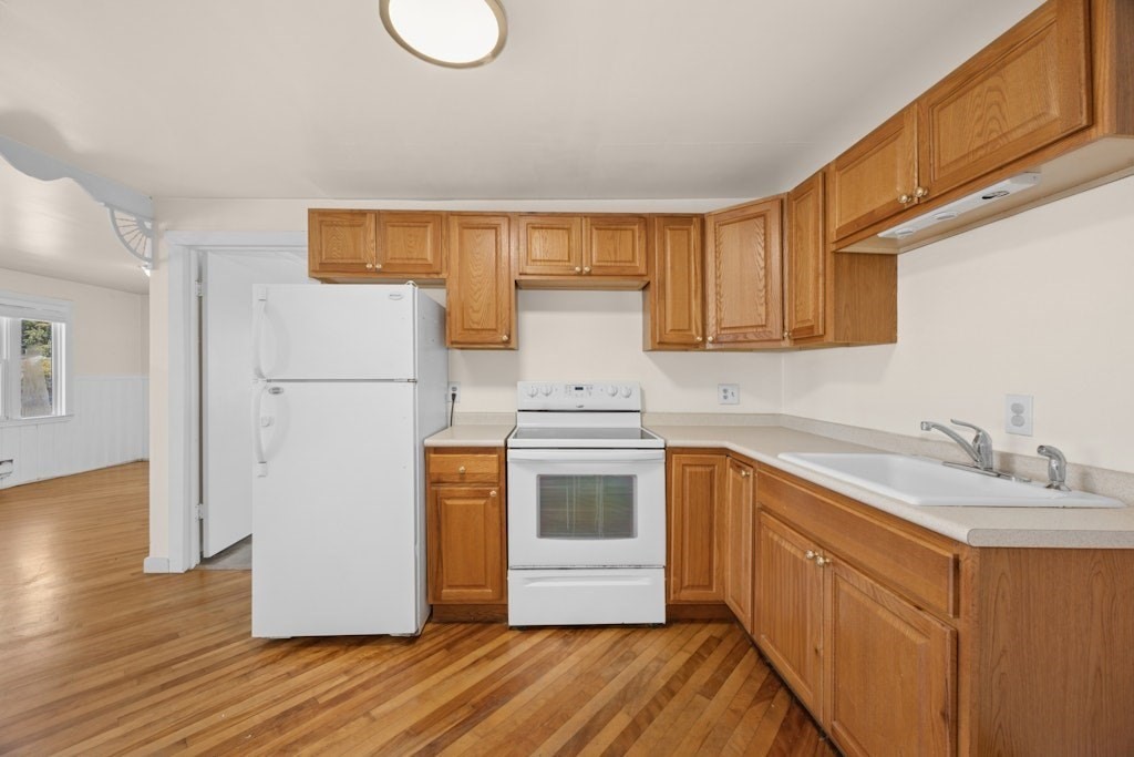 281 C King, Unit C Northborough, MA 01532 - Photo 5 of 19 a kitchen with a refrigerator sink stove and cabinets