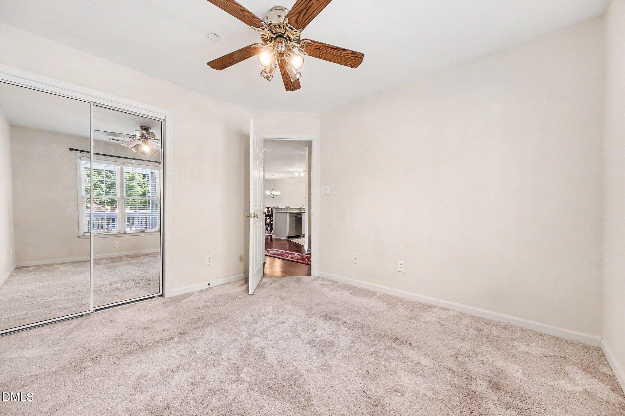 132 Springfork Drive Cary, NC 27513 - Photo 28 of 28 an empty room with windows and fan