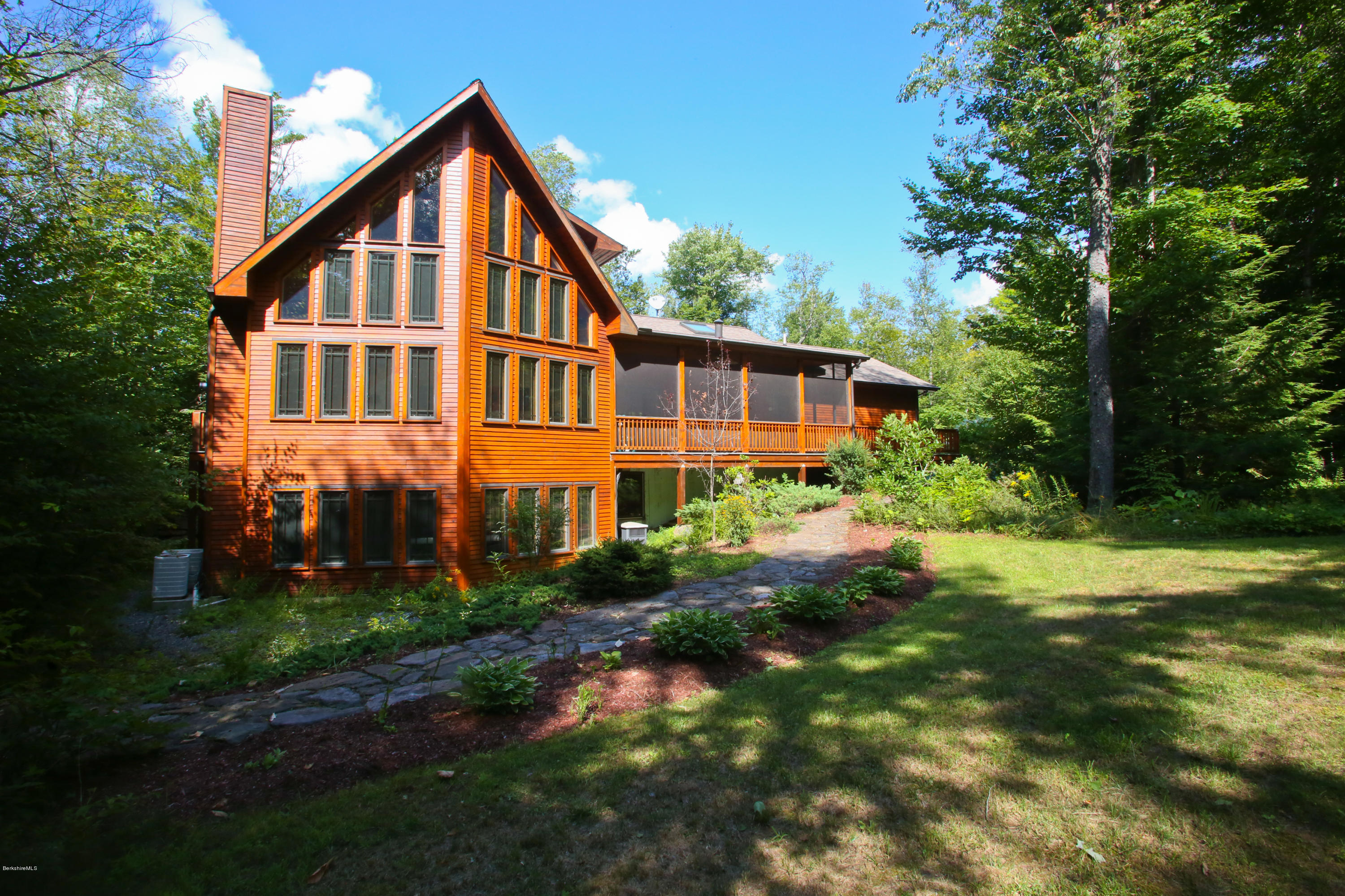 108 Valley View Road Becket, MA 01223 - Photo 1 of 35 a view of a house with backyard and garden