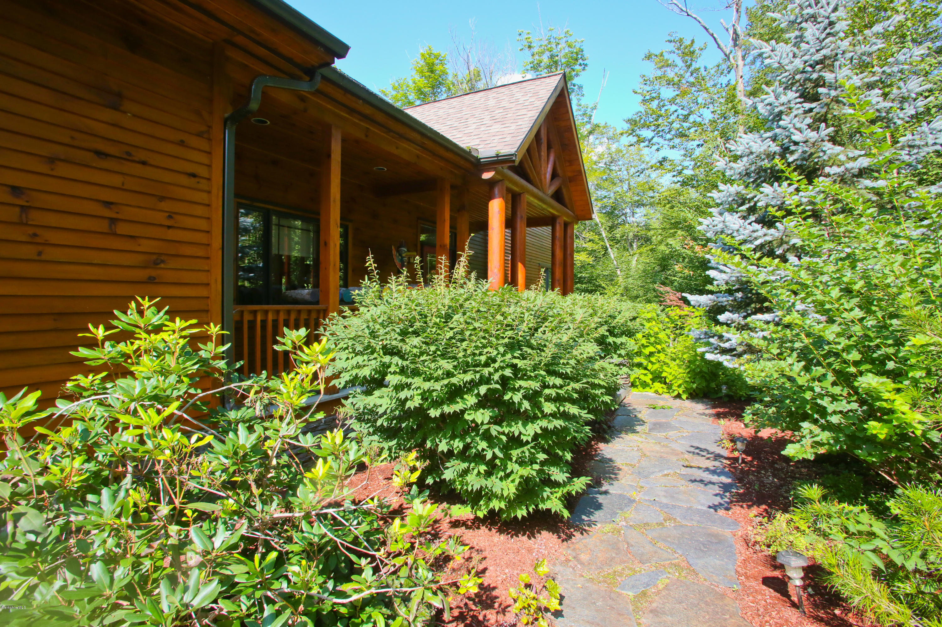 108 Valley View Road Becket, MA 01223 - Photo 3 of 35 front view of a house with a yard