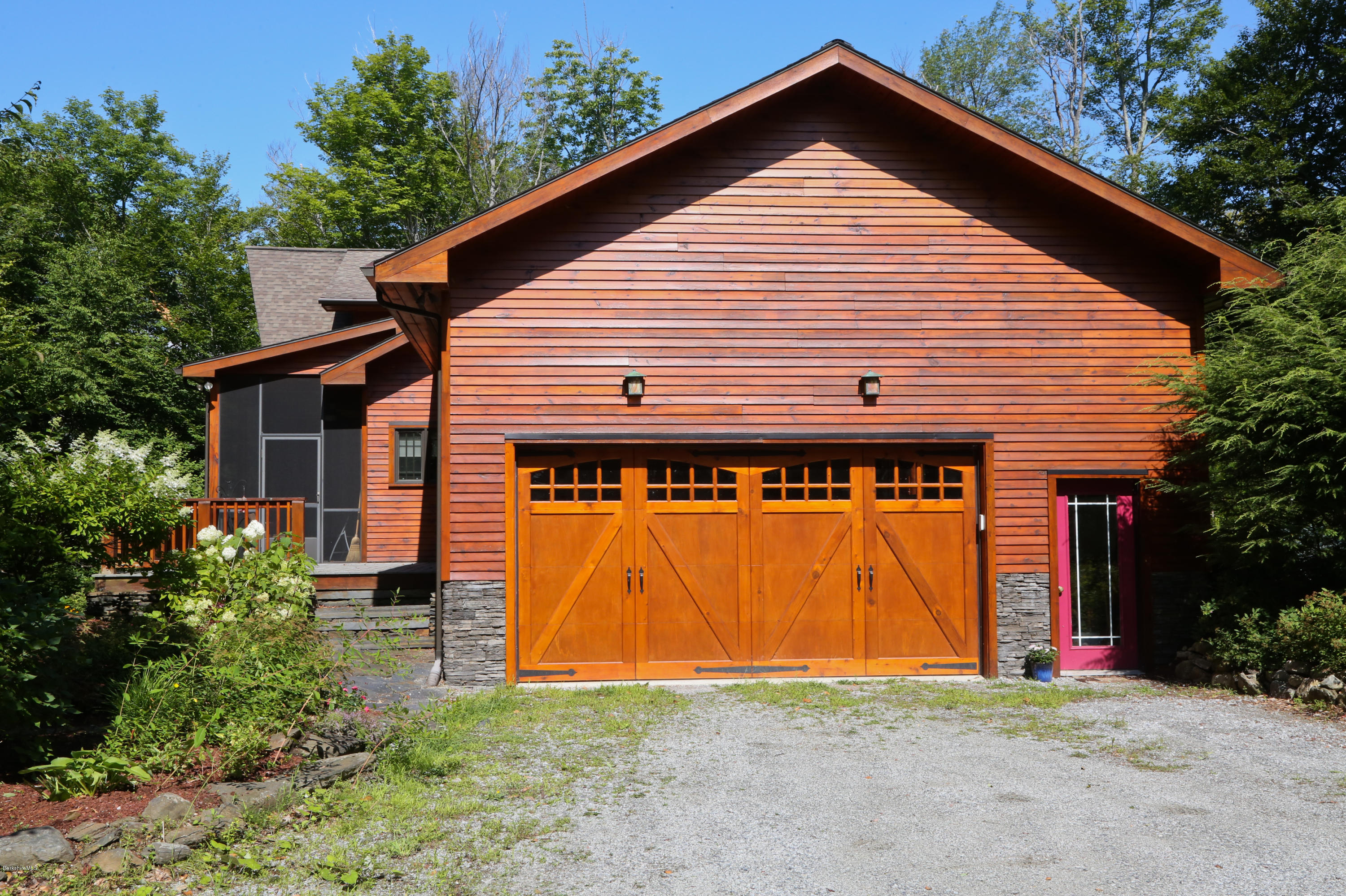 108 Valley View Road Becket, MA 01223 - Photo 29 of 35 a front view of house with garage and yard