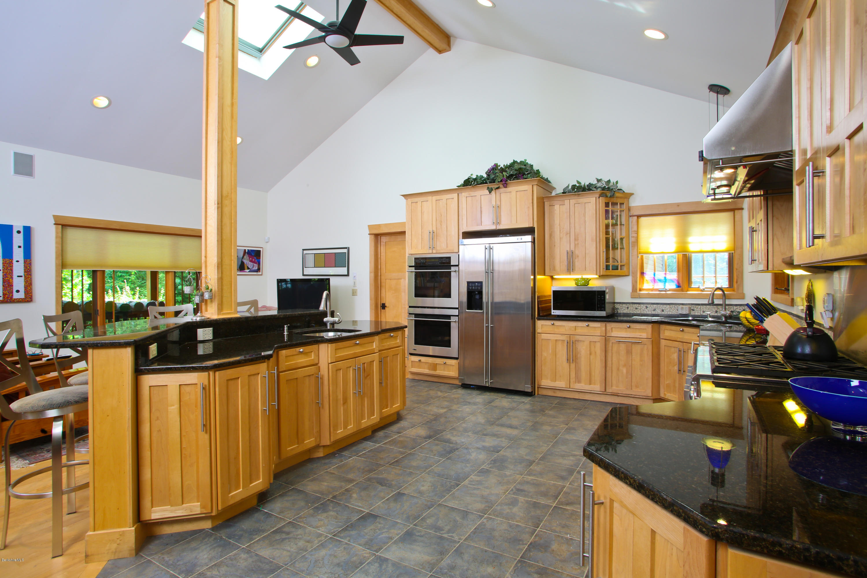 108 Valley View Road Becket, MA 01223 - Photo 10 of 35 a kitchen with stainless steel appliances granite countertop a sink counter space cabinets and a stove