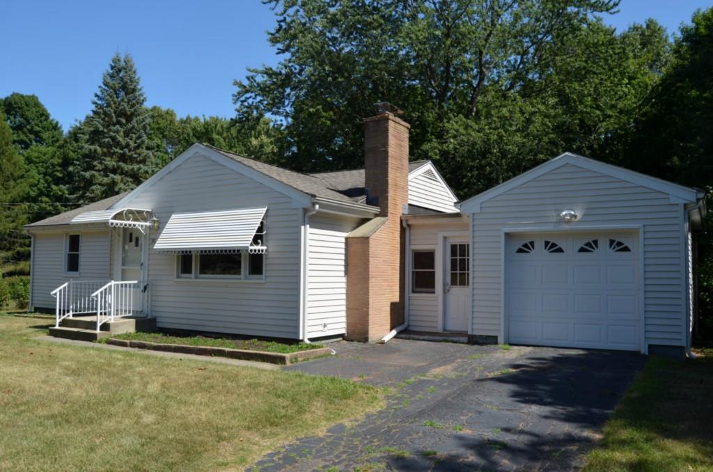 90 Stanley Road Hamden, CT 06514 - Photo 1 of 1 a front view of a house with a yard and garage