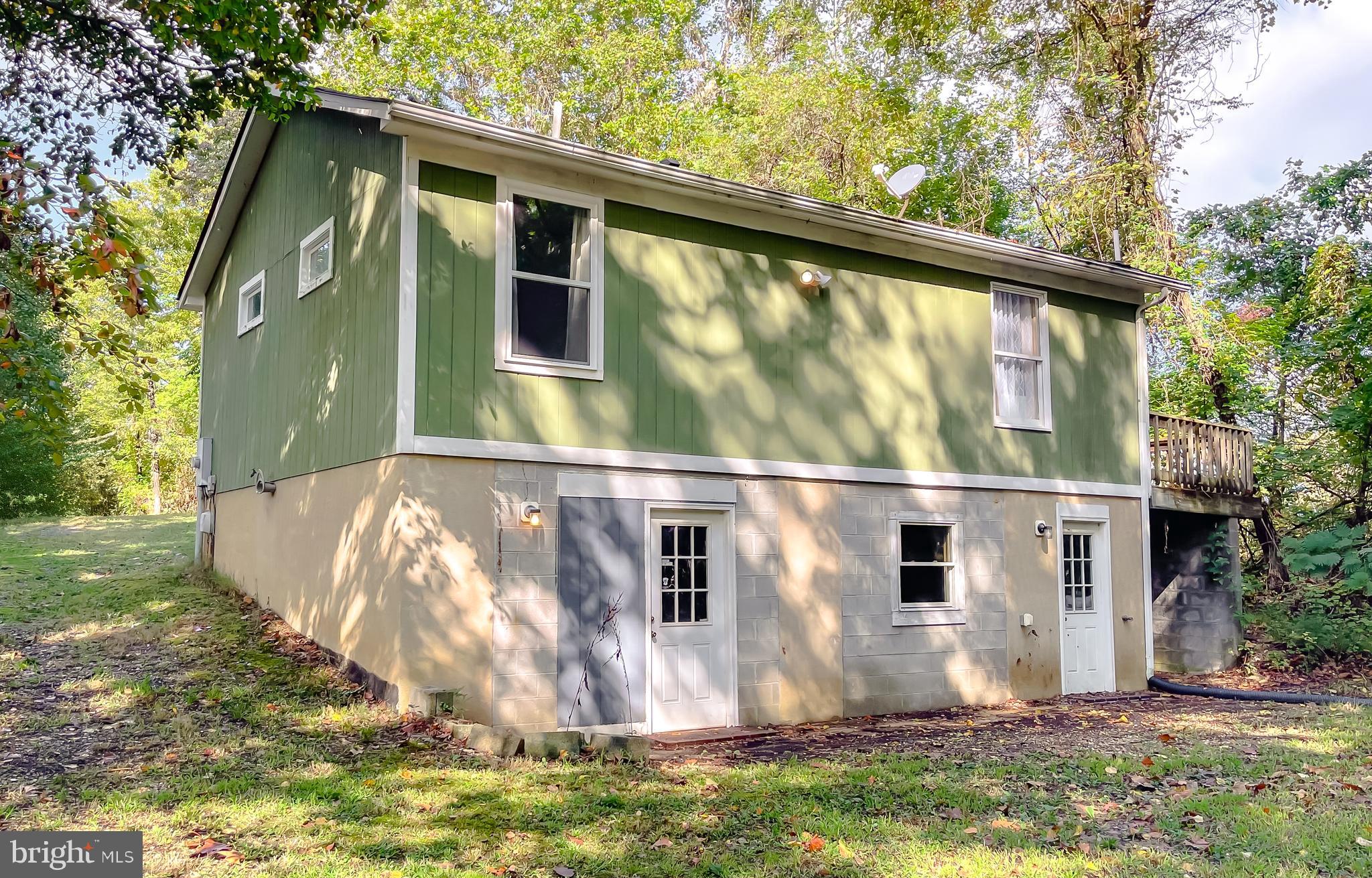 1090 Coster Road Lusby, MD 20657 - Photo 40 of 56 Rear of 2nd Home -workshop space and Lift space