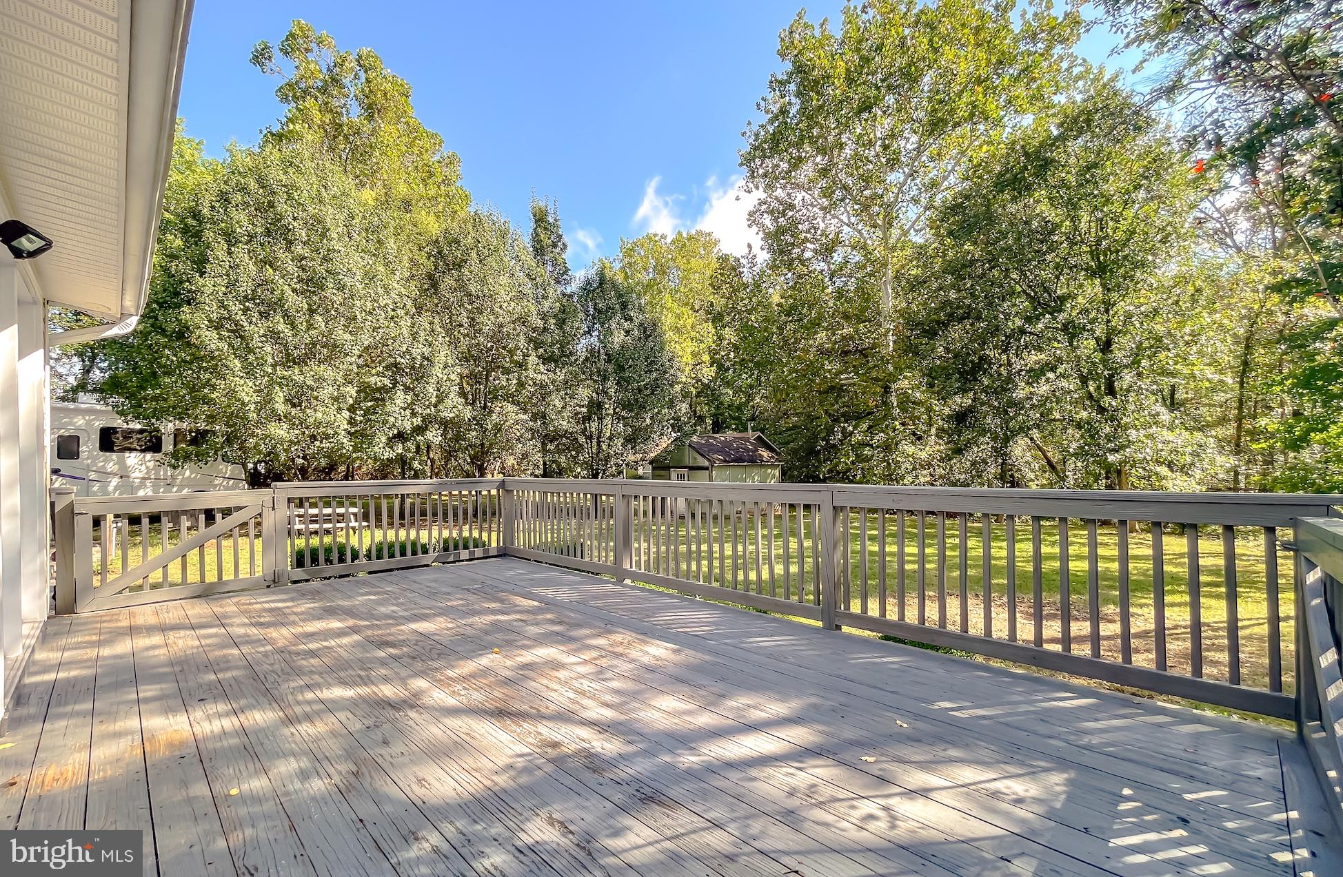 1090 Coster Road Lusby, MD 20657 - Photo 7 of 56 Spacious deck for relaxing - Primary Home