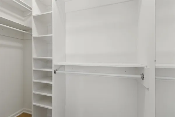 a view of an empty walk in closet