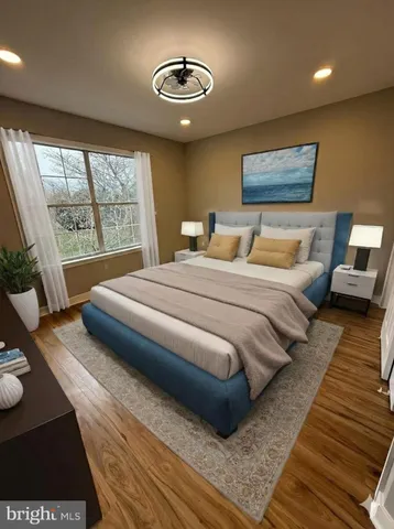 a bedroom with a bed and a night stand