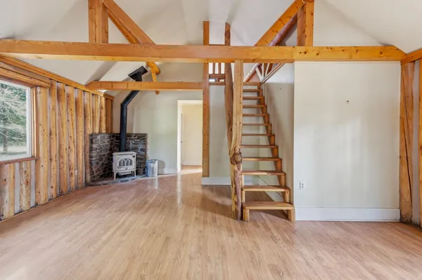 a view of an entryway with wooden floor