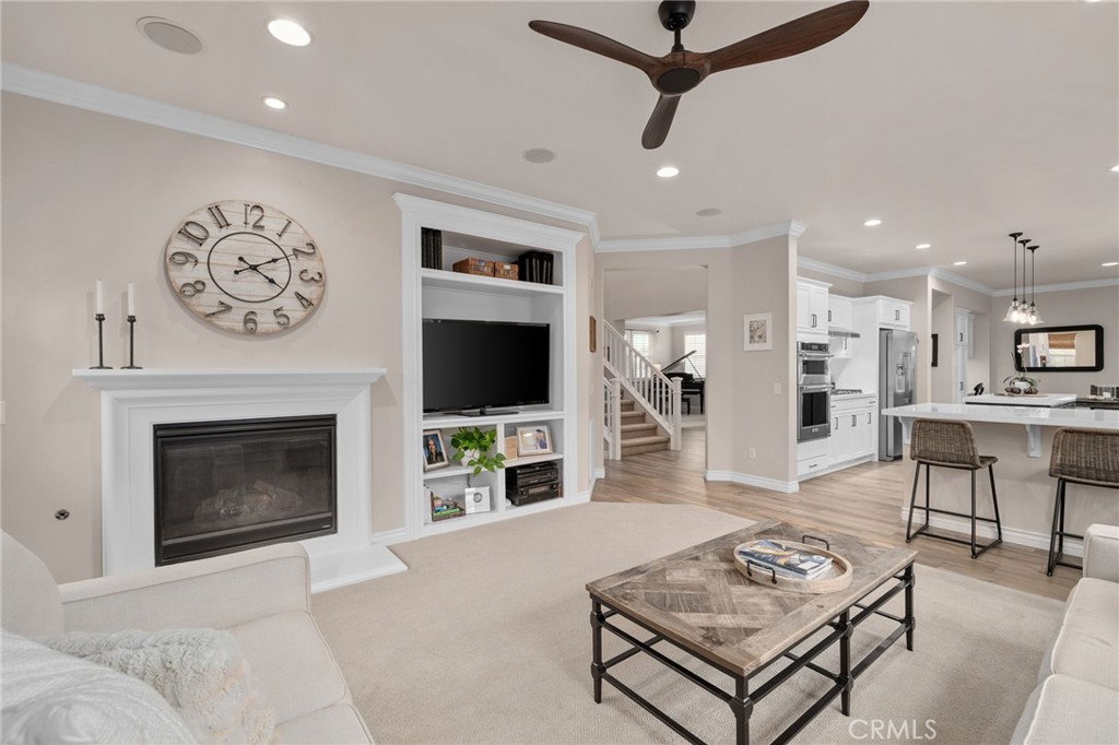 5156 Tahoe Place Rancho Cucamonga, CA 91739 - Photo 13 of 49 a living room with furniture a flat screen tv and a fireplace