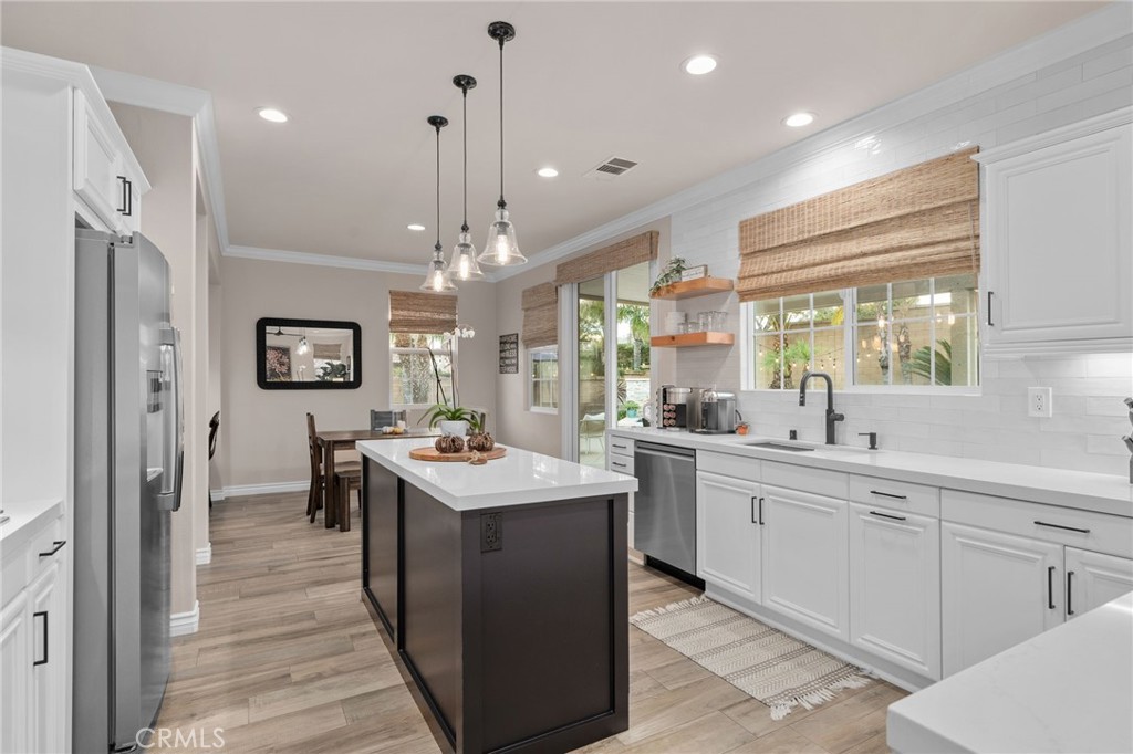 5156 Tahoe Place Rancho Cucamonga, CA 91739 - Photo 17 of 49 a large kitchen with a sink and refrigerator