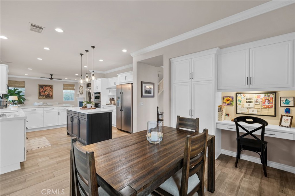 5156 Tahoe Place Rancho Cucamonga, CA 91739 - Photo 19 of 49 a view of a dining room with furniture and wooden floor