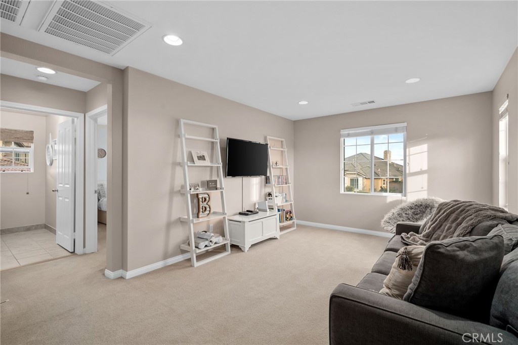5156 Tahoe Place Rancho Cucamonga, CA 91739 - Photo 20 of 49 a living room with furniture and a flat screen tv