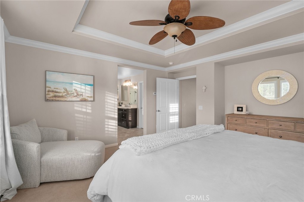 5156 Tahoe Place Rancho Cucamonga, CA 91739 - Photo 22 of 49 a bedroom with a large bed and ceiling fan