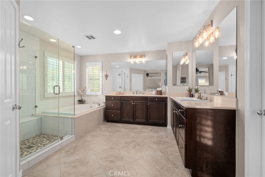 5156 Tahoe Place Rancho Cucamonga, CA 91739 - Photo 25 of 49 a large bathroom with a double vanity sink a large mirror and shower