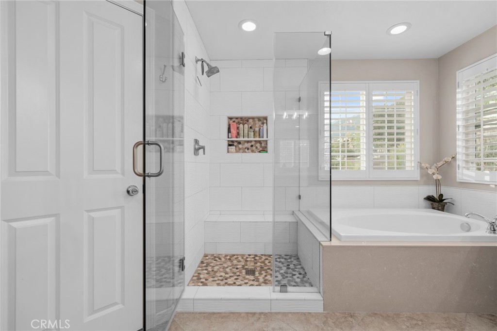 5156 Tahoe Place Rancho Cucamonga, CA 91739 - Photo 27 of 49 a bathroom with a bath tub and a shower