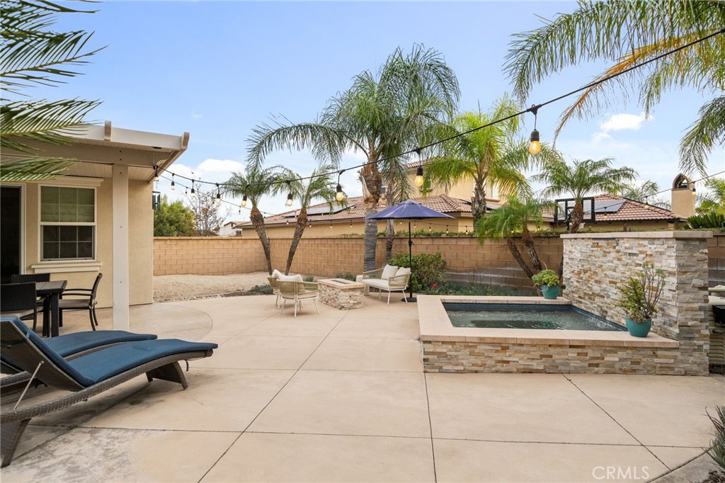 5156 Tahoe Place Rancho Cucamonga, CA 91739 - Photo 37 of 49 a view of a patio with a table and chairs